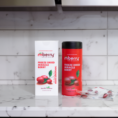 mberry Freeze Dried Miracle Berries on marble counter with marble tiles behind with individual berries to the right
